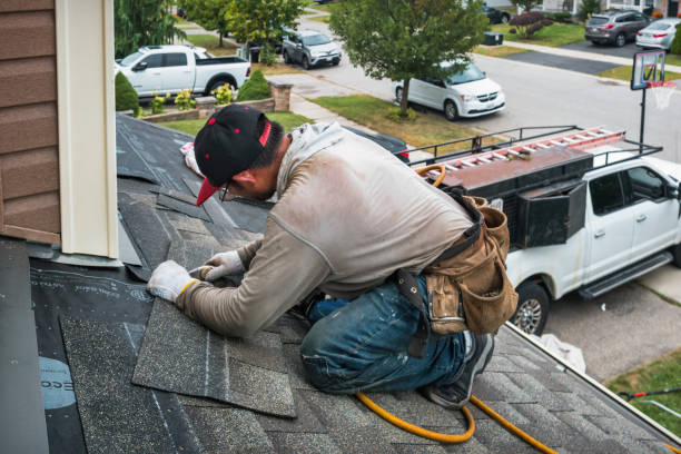 Professional Roofing technician working in Robins, IA